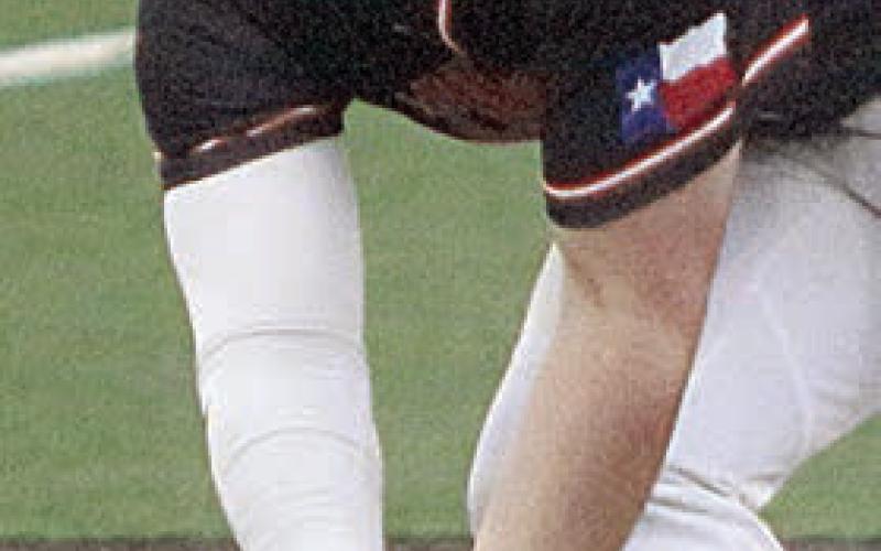 Third baseman Tyson Wagner scoops the ball up for a force out in the fourth. Sticker Photo By Darrell Vyvjala