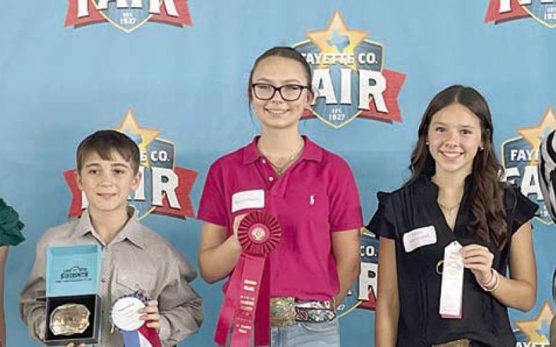 Overall High Point Intermediates – (from left) Kylee Hoffmann, Teen Miss Lone Star State agHERculture; Crockett Guenther, first place winner; Tatum Fritsch, second place winner; Alexis Berckenhoff, third place winner; and Justin Dahse, representing sponsor HEB. Guenther is a member of the Schulenburg 4-H.