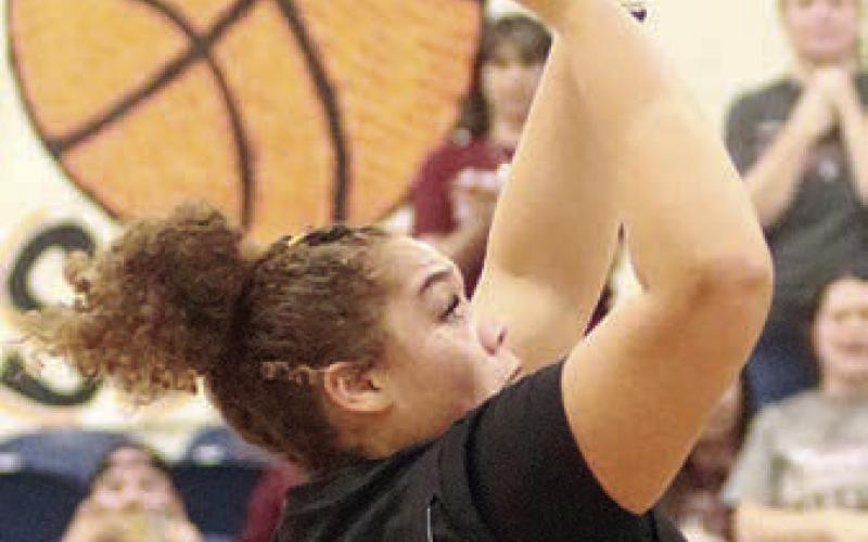 Arianna Vincent scores on a turn-around shot in the fourth quarter. Sticker Photo By Darrell Vyvjala