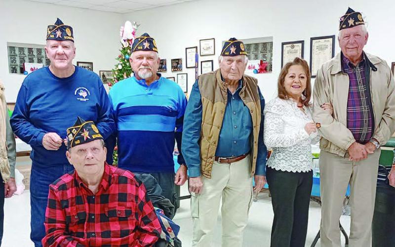 LEGION SERVICE AWARDS – (from left) Harvey Oeding, 15 years; C.W. Leonard, 10 years; in wheelchair, Terry Brown, 50 years; Jesse Lednicky, 5 years; Ben Cerny, 5 years; Renee Hranicky, 5 years; and Henry Miksch,15 years. Commander Bob Heinrich (right) is shown congratulating them. Others not shown are Jon Matus and Francis Ripper, 5 yrs.; Philip Davidson, Samuel Gordon and Ed Semler, 10 yrs.; Pete Goedecker, 15 yrs.; Travis Killion, 20 yrs.; Henry Galipp, 45 yrs.; and Oscar Hinkle and Daniel Kutac, 55 yrs.