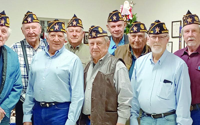 Perfect At endance Awards – Members recognized for attending every meeting in 2025 were (from left) Jimmy Sumbera, Gerald Smith, Tom Marek, Alvin Hajek, Ruben Rodriguez, Jack Niesner, Robert Hranicky, Jim Brown, Ben Cerny, Michael Bartosch, Harry Bartosch, Harvey Hermis and (right) Dennis Olsovsky. Not shown are Vernon Dittrich and Paul Hunsucker. Congratulating the members was commander Bob Heinrich (second from right).