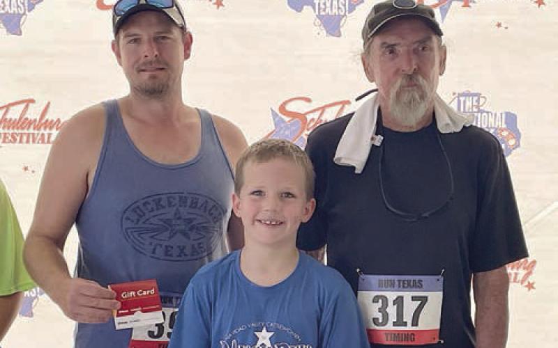 Farthest traveled / youngest / ‘most seasoned’ – (from left) Branden Dierschke, who traveled 166 miles; Matthew McGee, the youngest 5K entry; and Jimmy McIntire, the oldest 5K entry. Sticker Photo By Darrell Vyvjala