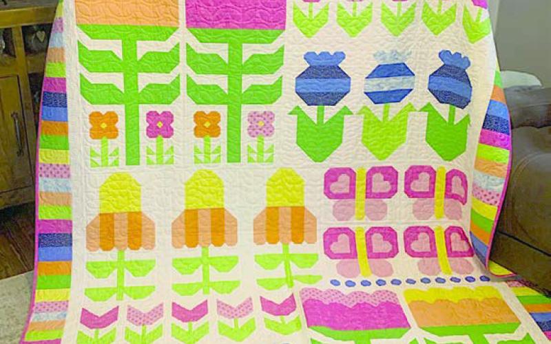 Steve Kana from Schulenburg was the 2026 winner of the drawing for a quilt at the Colorado Valley Quilt Guild’s “Best Little Quilt Show in Texas,” held on Friday and Saturday, Feb. 27-28 at the KC Hall in La Grange. Carol Kana pictured with the “Flower Power” quilt.