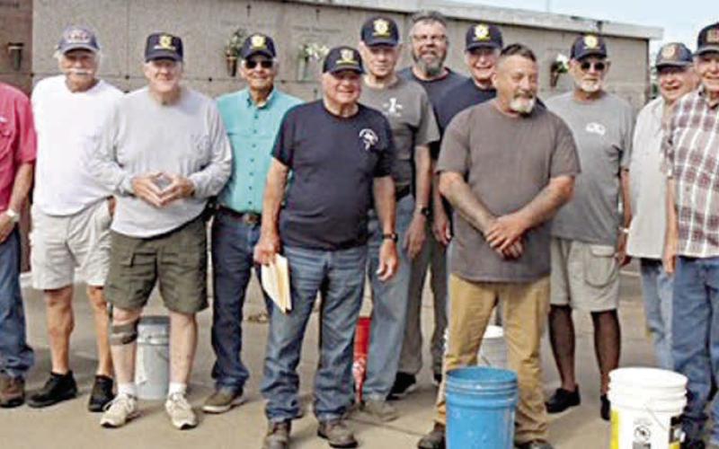 Over 1,200 flags were placed on th e graves of veterans in several area cemeteries, including over 675 flags at the Schulenburg City Cemetery and St. Rose of Lima Catholic Cemetery. In the top photo, a group of volunteers poses with flags at the Schulenburg City Cemetery, and in the bottom photo, volunteers stand in front of the mausoleum at the St. Rose of Lima Catholic Cemetery.