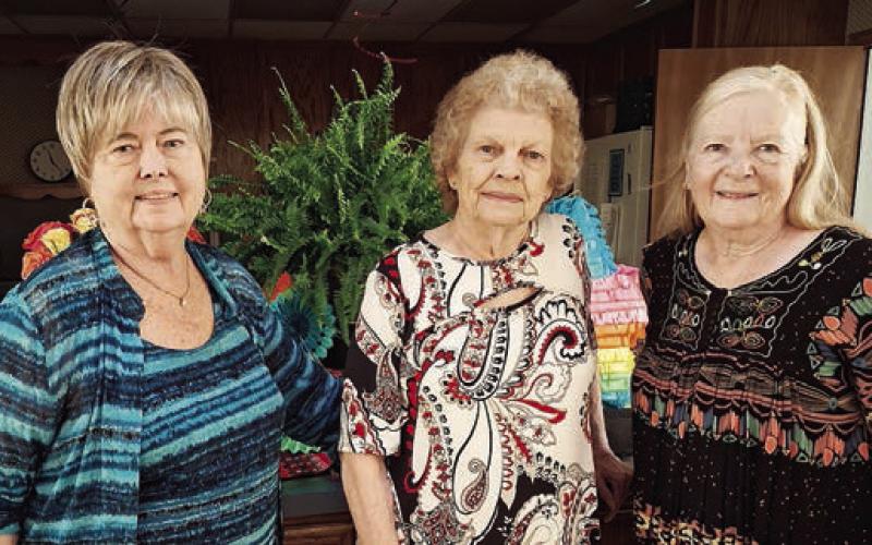 Hostesses were (from left) Bonnie Baker, Jerry Leonard and Janet Murphy.