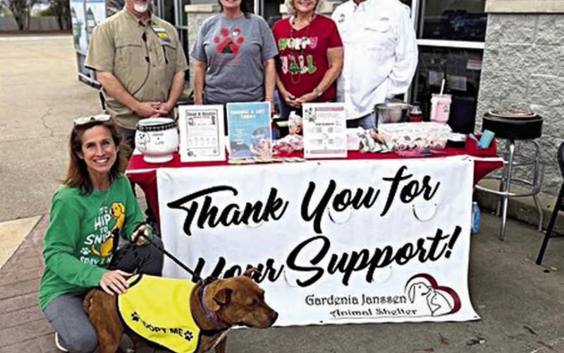 Walmart in La Grange was the location for a fundraising and awareness event hosted by the Gardenia E. Janssen Animal Shelter and also made a $4,000 contribution to the shelter. Shown are (front)Antoinette Joplin, GJAS volunteer with Hazelnut (available for adoption); (back row, from left) Kevin Ickles, Walmart store manager; Teresa Brown, GJAS executive director, Cindy Klosel, GJAS board director; and Frank Reichert, GJAS board president.