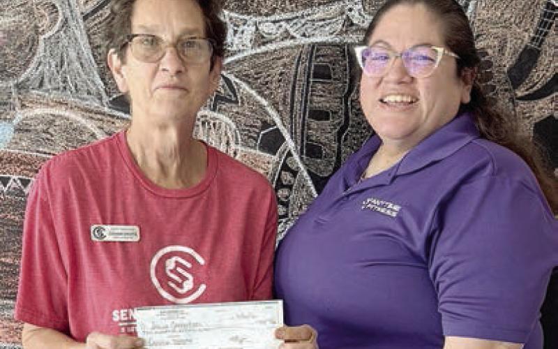 New registration fees for April were donated by Anytime Fitness.Program director Stephanie Shroyer (left) received the donation from Amanda Brown (right). Senior Connections is so grateful to Anytime Fitness for this kind gesture.