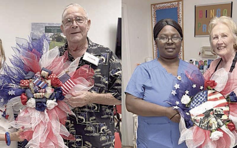 Volunteers recently coordinated a drawing, which included these beautiful decorations created by Matha Beckmann (left), to raise funds for the new Senior Connections building. In the photo at left, she presents one of them to Frank Lafferty, who also won a cross. In the photo at right, Sharon Rodriguez (right) presents the wreath to Katina Thomas. Almost $2,000 was raised through this project.