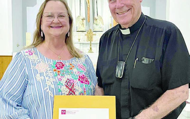 ROSANNE GALLIA (left) and FATHER JASPER LIGGIO