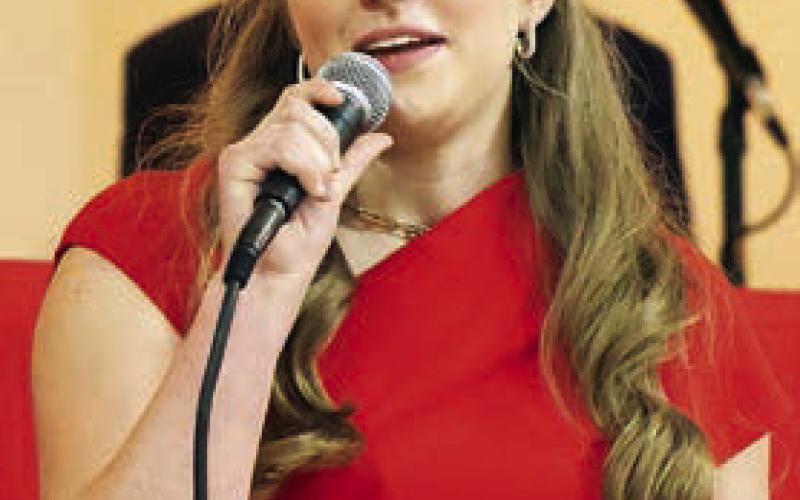 Reagan Moreau speaks on behalf of her father, Craig, at the forum. Photos By Melanie Berger / Courtesy of Flatonia Argus