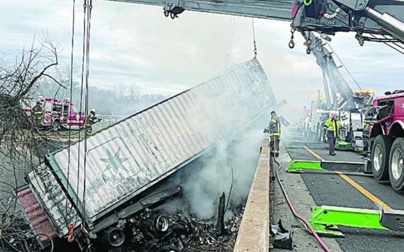 Cranes hoist the trailer from the creekbed as part of the cleanup that continued throughout Monday morning after the accident. Photo Courtesy of SVFD