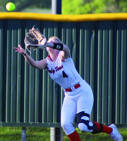 Left-fielder Angel Davis runs down a Maiden line drive. Sticker Photo By Darrell Vyvjala