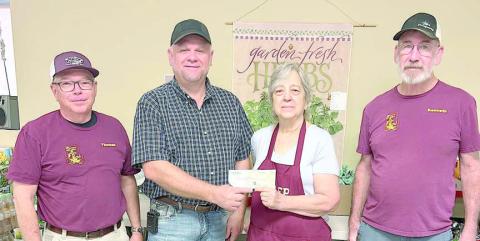 Schulenburg Knights of Columbus Council 2902 recently donated $500 to the Schulenburg Area Food Pantry. Shown are (from left) Tom Janda, Food Pantry volunteer; Paul Zapalac, Council 2902 grand knight; Debbie Behlen, Food Pantry volunteer; and Kenneth Behlen, KC member and Food Pantry volunteer.