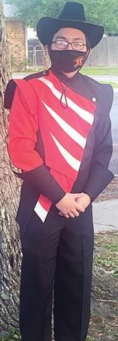 Junior band member Rosendo Gonzalez shows off the new uniform.
