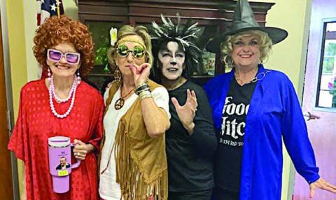 Chosen as the best four costum ed members were (from left) Betty Herzik (Mrs. Roper), Diana Mikesky (Hippie Chick), Marilyn Mokwa (Spooky Black Cat) and Debra Blansitt (the Good/Bad Witch).