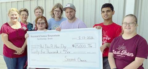 On hand as Seco nd Chance Empor ium made a donation to And Then A New Day were (from left) Marlene Schnell, SCE assistant store director; Sharon Pargac, SCE church volunteer; Marian Tajchman; SCE church coordinator; and Brooke Shimek, Emma Kubala, Ty Janak, Anthony Benedict and Mary Svec, representing And Then A New Day.
