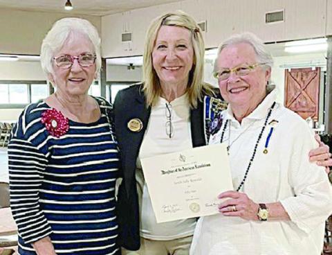 A 50-year membership awar d was presented to Sally Reynolds (right), honoring her dedication and contributions to the Daughters of the American Revolution, by Smith-McMillan DAR regent Carolyn Caflisch (left) and treasurer Jackie Head (center).