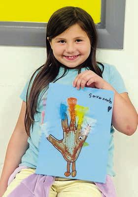 During the last week’s arts and crafts program at the Schulenburg Unit of the Boys &amp; Girls Club, members participated in creating decorations for Thanksgiving such as making hand turkeys and utilizing feathers for a more festive appearance around the Club! Shown is club member Savannah Villanueva. The Boys &amp; Girls Club hopes everyone has a wonderful Thanksgiving!