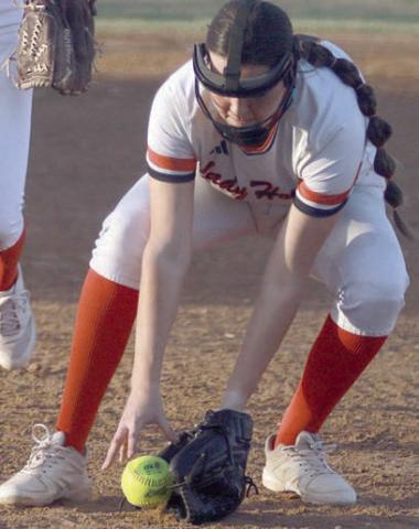 Pitcher Brenley Bujnoch fields a Bloomington bunt for an out in the third inning. Sticker Photo By Darrell Vyvjala