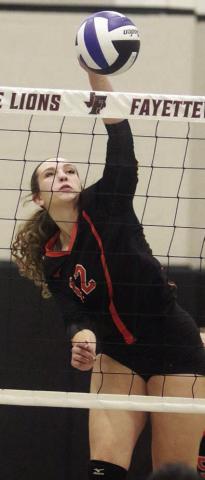 Grace Schramek connects for one of her two kills early in game three to help the Lady Horns jump ahead 11-0. Sticker Photo By Darrell Vyvjala