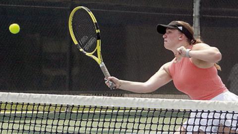 Mikayla Otto makes a play at the net. Sticker Photo By Darrell Vyvjala
