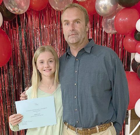 Mallory Bonner of St. Rose of Lima Catholic School with her dad, Matt Bonner.