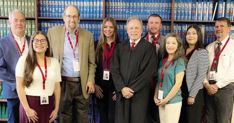 Eight new volunteers for CASA of Bastrop, Fayette &amp; Lee Counties were sworn in on Nov. 18 in Bastrop. Shown are (from left) new CASA volunteers Jim Barringer of Bastrop, Judit Castillo of Elgin, Bill Laubenberg of Elgin and Morgan Heine of Elgin; Benton Eskew, county court at law judge in Bastrop County who performed the swearing-in; and new volunteers Gage Counts of Bastrop, Alma Villareal of Flatonia, Johana Cardenas of Bastrop and Howard Griffith of Bastrop.