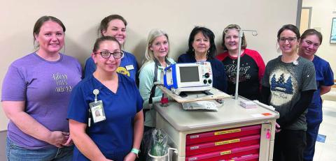 New defibrillator /monitors purchased by St. Mark’s Medical Center in La Grange with funds from Second Chance Emporium (SCE) are shown with (front row, from left) Alyssa Smidovec, RN, St. Mark’s; Ashley Havel, St. Mark’s imaging director; (back row) Stacy Cada, SCE assistant store director; Julia Thomas, SCE assistant store director; Gayle Schielack, SCE store director; Laurie Quitta, RN, St. Mark’s MedSurg director; Linda Morrison, SCE board secretary; and Melissa Taylor, LVN, St. Mark’s.