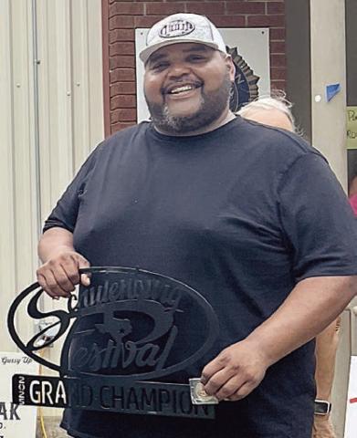 GRAND CHAMPION / 1ST PLACE RIBS / 1ST PLACE BRISKET – “Flying G Barbecue,” represented by Ira Green. Sticker Photo By Kade Vyvjala