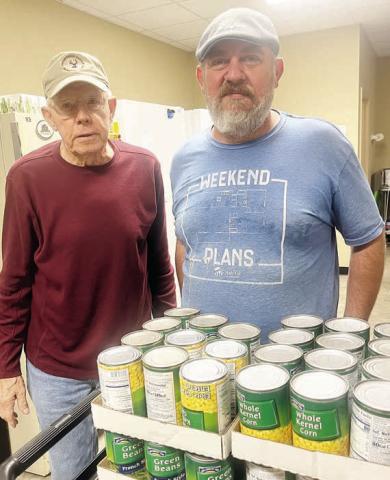Fayette County Habitat for Humanity, represented by Kenny Couch (right), recently delivered 116 pounds of non-perishable food collected in its food drive to the Schulenburg Area Food Pantry. Accepting the donation on behalf of the Food Pantry was volunteer Ken Berger (left).