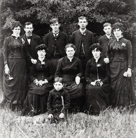 The Louis and Mary (Loessin) Luck Family photographed by G. A. Pannewitz in the mid-1880s. Charles P. Luck is standing second from right. Courtesy of Fayette Heritage Museum & Archives