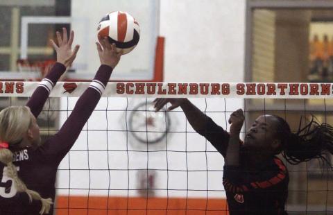 Jessalyn Gipson bangs a kill off a Maiden block attempt in the first set, one of her 15 last Tuesday. Sticker Photo By Darrell Vyvjala