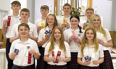 Grades 7-8 Winners – (front row, from left) Patrick Taylor, Reese Dusek, Mallory Bonner, (middle row) Bo Brossmann, Caroline Bartek, Charlotte Schmidt, Saybra Pinney, (back row) Kaleb Zapalac, Brett Hollas, William Eudy and Weston Hollas.