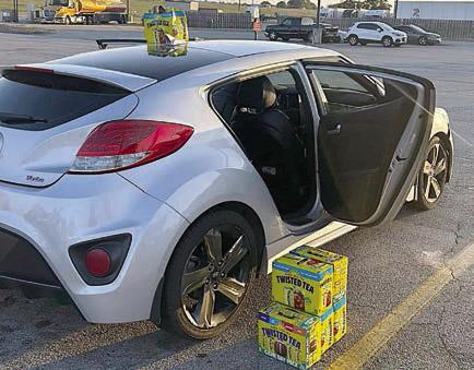 The silver hatchback is pictured after SPD officers stopped it at Love’s Travel Stop in Weimar with the Twisted Tea cases stolen from The Texan in Schulenburg.