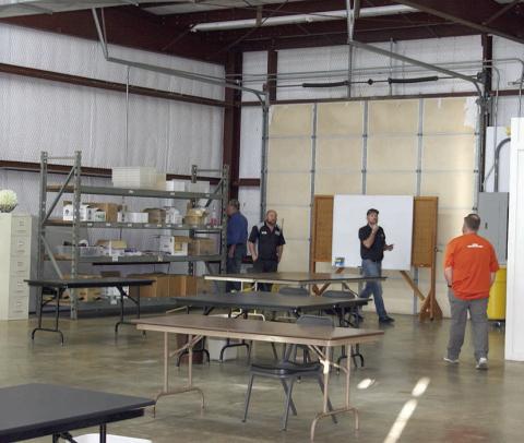 Schulenburg ISD school board members (from left) Mike Zweschper, Jarrod Schramek, Joel Blansitt, and Michael “Dumas” Demel walk through the workshop during their tour of the Henry Dittrich Sr. Enterprises Building last week. Sticker Photo By Darrell Vyvjala