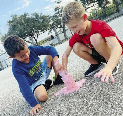 During last week’s STEM project at the Schulenburg Unit of the Boys &amp; Girls Club, members mixed baking soda, vinegar and food coloring to make fizzing Halloween magic potions. It was a spooky good time! Shown are Club members Valdemar Pineda (left) and Braxton Spradley (right).