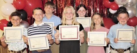 Top 5th Grade Students – (from left) Cal Schiffli, math, reading, science and social studies; Cannon Lykke, band; Bryson Ohnheiser, computer; Brynlee Berger, religion; Charlotte Schmidt, band most improved; Clare Besetzny, reading, English and band; and Abraham McBride, computer.