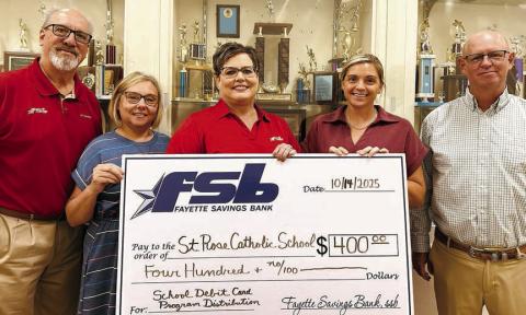 On ha nd as Fayett e Savings Bank presented a check to St. Rose of Lima Catholic School through its School Spirit Debit Card Program were (from left) Mike Olle, FSB; Michele Kubos, St. Rose School bookkeeper; Cheryl Brossmann, FSB; Taylor Jensen, St. Rose School principal; and Gary Zweschper, St. Rose School Advisory Council president.