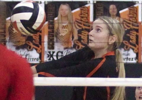 Madison Kunschick picks up a dig in the third set of the Lady Horns’ sweep of Brazos. Sticker Photo By Darrell Vyvjala