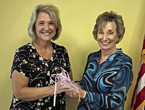 Accepting the president’s gavel from outgoing president Diana Mikesky (right) is Sue Broadwater (left).