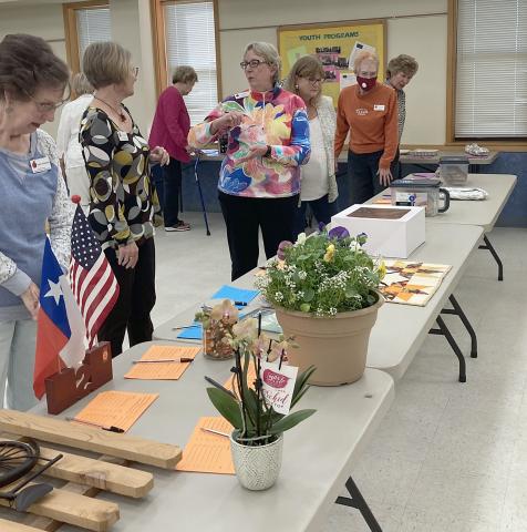 Fayette County ReTIred Teachers Association members view silent auction items.