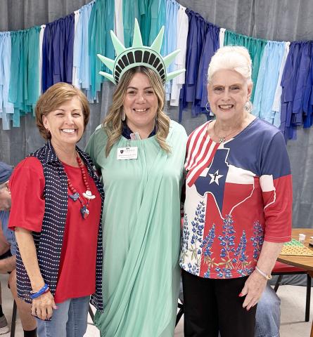 Jessica Campbell (center) from Crown Hospice, is shown with Martha Beckmann and Betty Stolarski. Campbell was the bingo caller just before the 4th of July, and she entertained everyone with her costume!