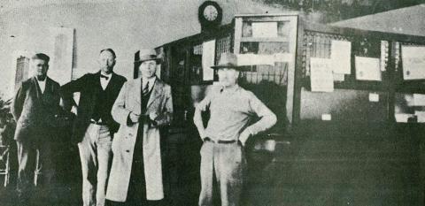 Interior of Carmine State Bank – From left, the men are William Pluekhahn, H.L.F. Doerr Sr., Alfred Blum and W. H. Stuermer. Photo from March 4, 1986 issue of Fayette County Record