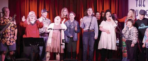 And Then A New Day members participated in a song-writing workshop which concluded with a performance at the Bugle Boy. Shown are (front row, from left) Will Kuhn, Preslie Foster, Brooke Shimek, Mary Wellborn, Caitlin Lewis, Eleanor Benbenek, Amy Vaculik, (back row) Ashton Novicke, Emma Kubala, Shelby Purcell, Jessica Shank, Joelle Mihalovich-Williams, Terri Hendrix-musician/songwriter and Ty Janak. Member not shown is Sirkka Higgs.