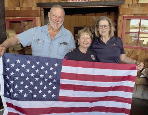 U.S. flag was presented to the Colorado County EMS in Weimar by the Schulenburg Hermann Sons Life lodge. Shown are (from left) lodge president Ed Moeller, Marilyn Hinze of Colorado County EMS and lodge vice president Mary K. Seifert.