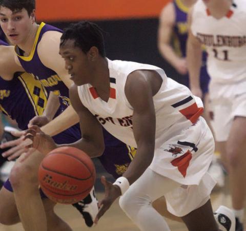 DeMarion Glass picks up a steal in the first quarter against Weimar. Sticker Photo By Darrell Vyvjala