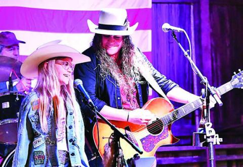 Briana Adams (right) was joined by Marley Vasek (left) for a performance at Holman Valley Steakhouse that raised funds for three animal welfare organizations in the area. Adams is a singer/songwriter who grew up in Winchester and has been touring all over Texas for the past 12 years.