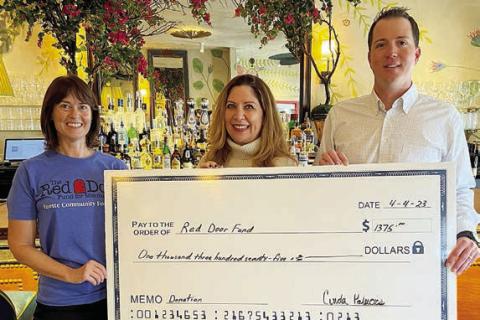 Lulu’s raised $1,375 for the Red Door Fund for Mental Health. Shown at the check presentation are (from left) Christine Scully of RDF; Cinda Palacios of Lulu’s; and Jordan Beeman, president of HeartBrand Beef, which provided steaks for the benefit dinners.