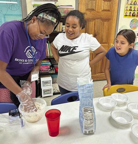 In the arts and crafts program, Club members had a blast making their own play dough. Shown are (from left) staff member Taliyah Wright and Club members Dynasti Wright and Jocelyn Alejandres.