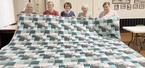 This handmade quilt will be auctioned at the annual picnic of St. Mary’s Catholic Church in High Hill on Sunday, Sept. 6. St. Anne’s Society members who constructed the quilt included (from left) Jan Ripper, Karen Miley, Lillian Hilscher, Georgia Cerny and Lorine Machicek. The auction will start at 1 p.m. The picnic will also include a flag-raising, dedication of the High Hill cross, Mass, fried chicken/stew dinner, music/dance, fireworks show and numerous other activities.